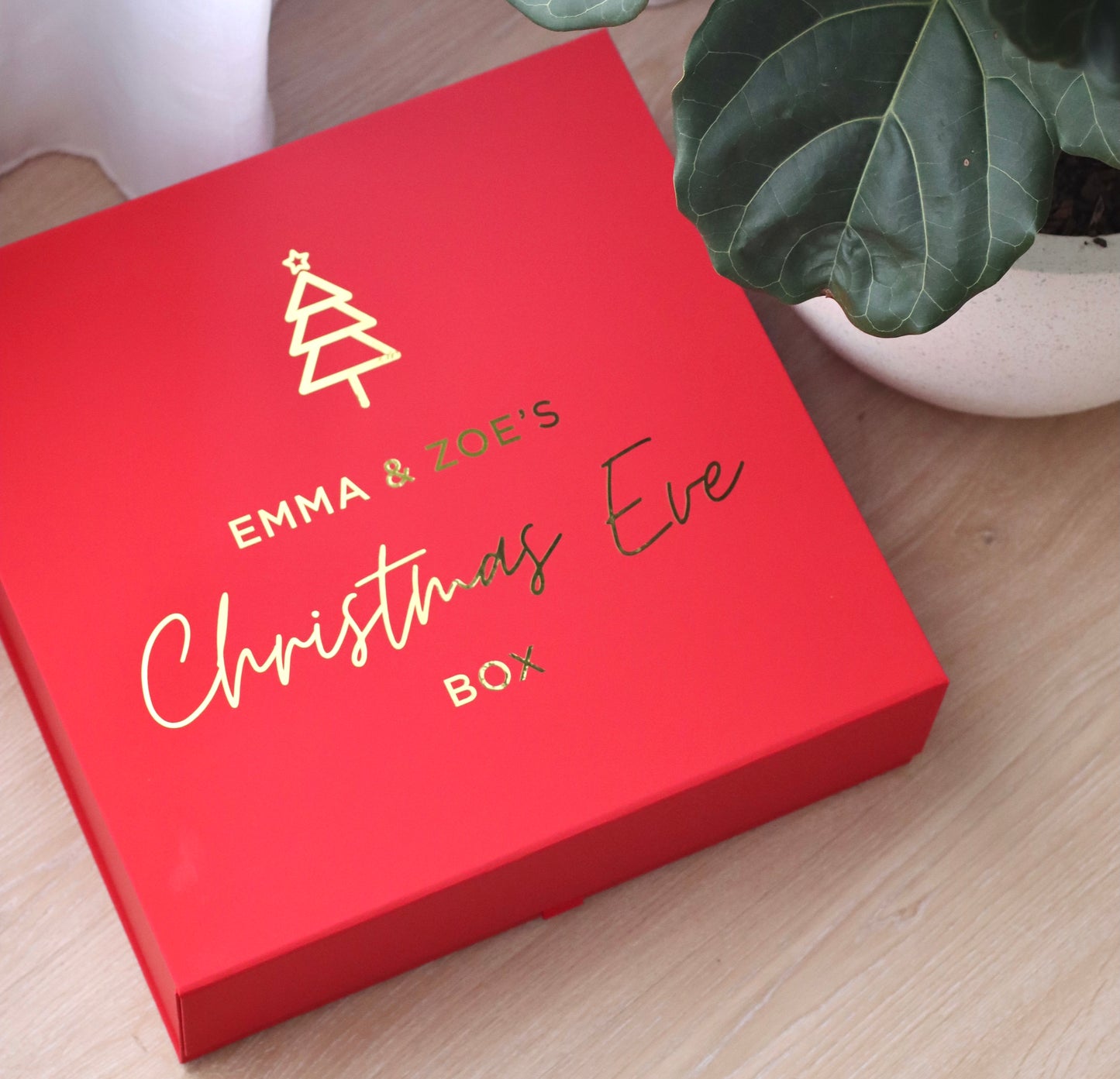 Red Christmas Eve Box - Boxes are made of a red laminated cardboard with a magnetic closure.