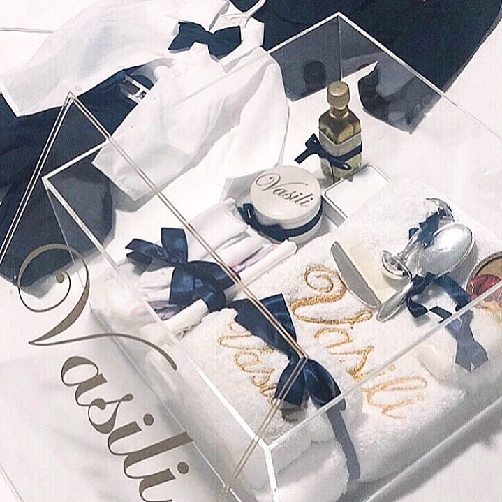 Luxe Orthodox Package 1 x Your choice of White Extra Large Box, Clear Extra Large Acrylic Box, No Box. (Price varies depending on which option you choose.) 1 x Embroidered Bath Towel 1 x Embroidered Hand Towel 1 x Oil Sheet & Cap 1 x Singlet 1 x Oil 1 x Personalised Trinket Box 1 x Soap 1 x Socks 1 x Icon 1 x Rattle 1 x Brush Set