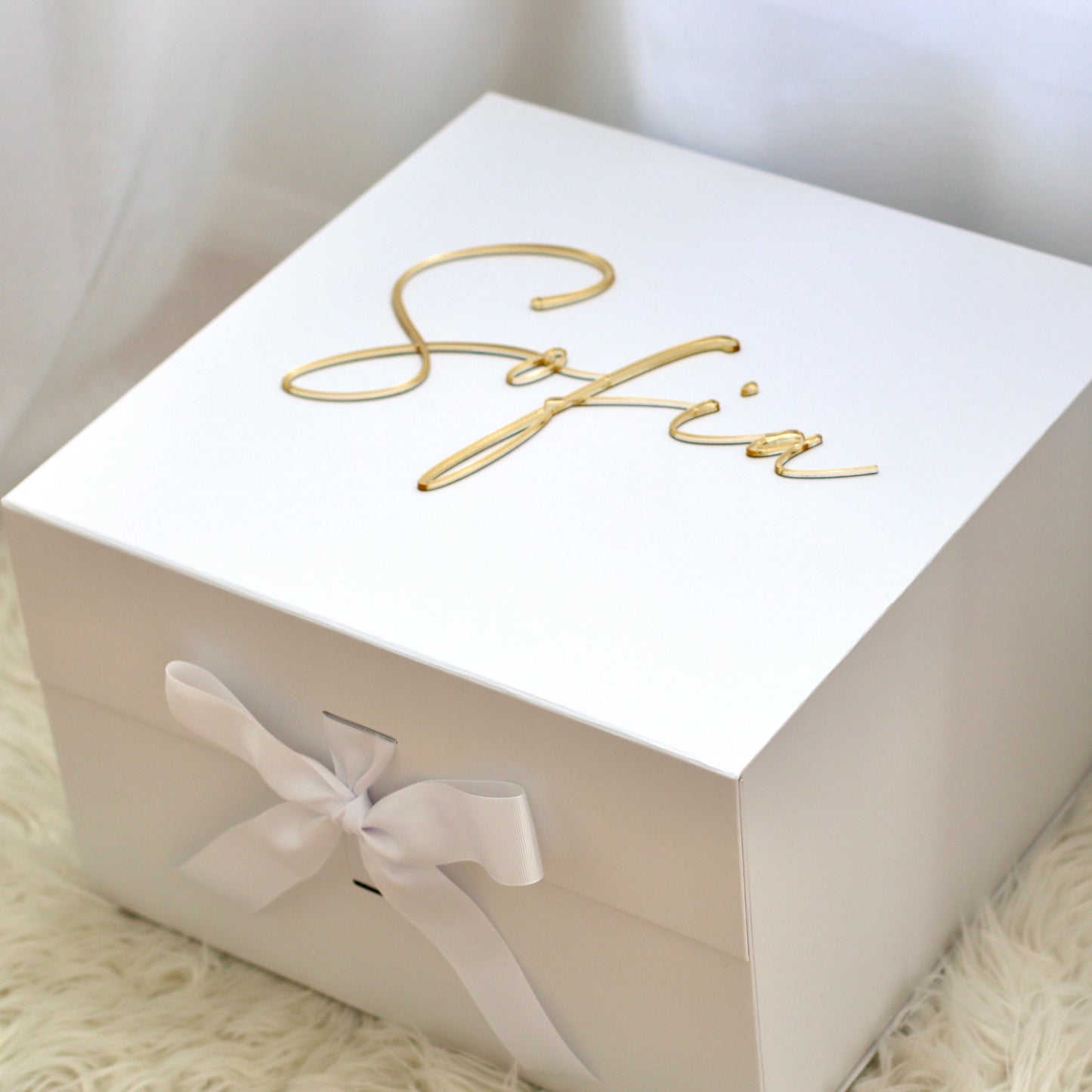 A sturdy, rigid collapsible gift box made from 2.8mm (approx.) board and covered with a bright white paper inside and a protective matte laminate coating inside and out. Makes any gift a delightful surprise for any recipient.