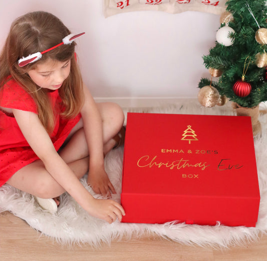 Red Christmas Eve Box - Boxes are made of a red laminated cardboard with a magnetic closure.