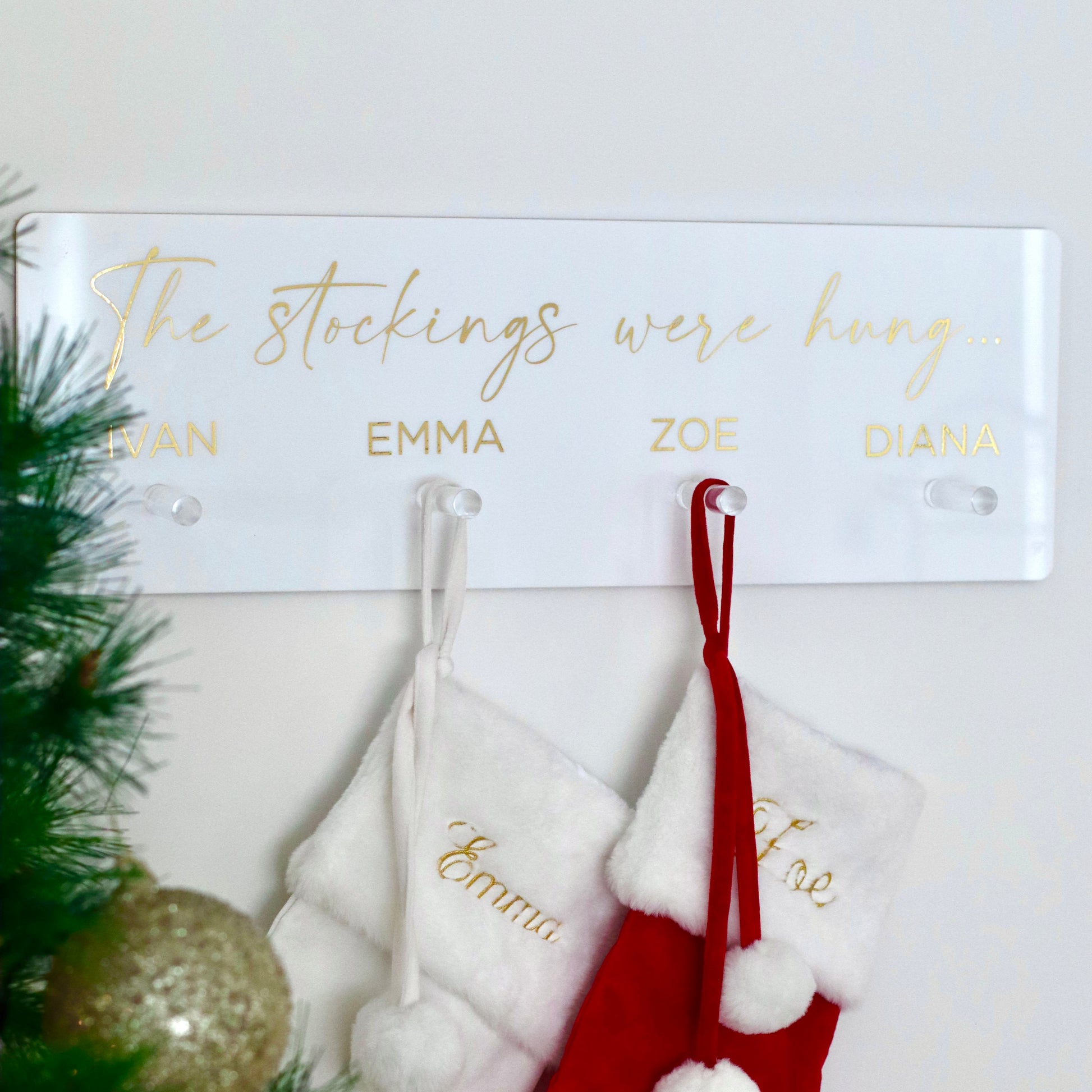 Our personalised Christmas stocking hanger, personalised to include include names above hooks or not
