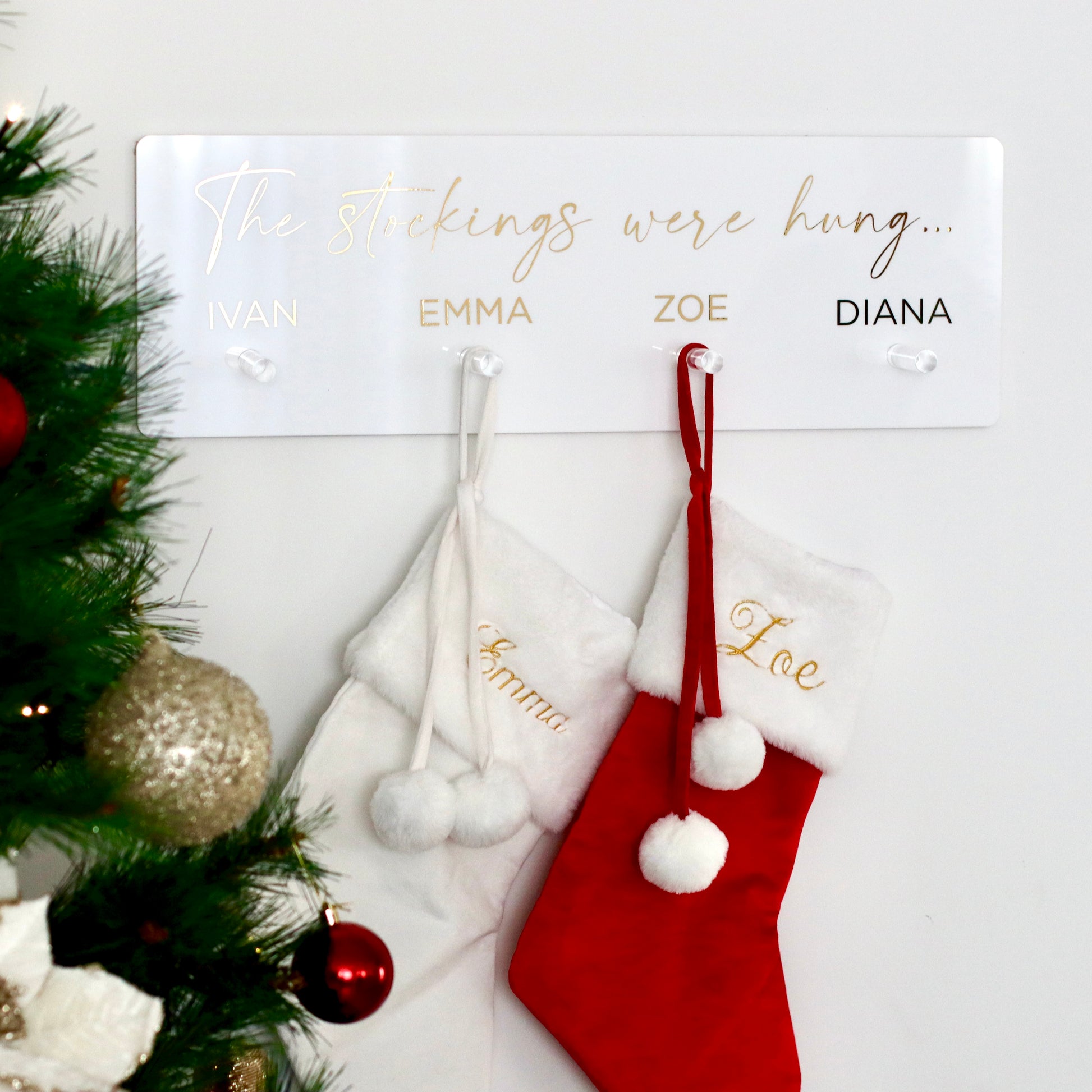 Our personalised Christmas stocking hanger, personalised to include include names above hooks or not