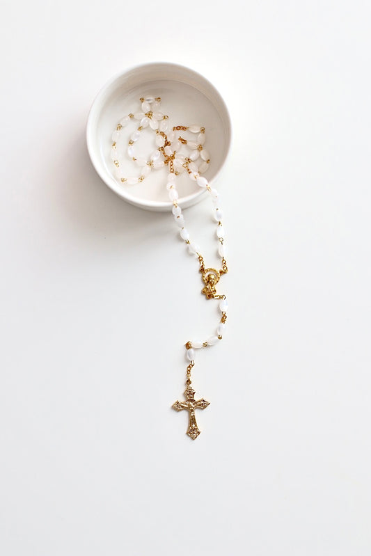 Mother of Pearl Rosary w/ Gold Hardware  Our Gold Rosary with teardrop beads, perfect as a gift for a baptism or christening, or a communion gift. 