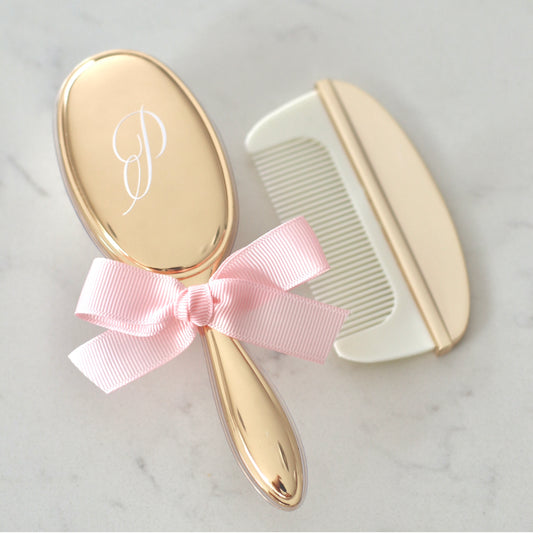 Silver, Gold, or Rose Gold plated baby brush and comb set, which comes in a box. The brush can personalised on the back with 1-2 initials.