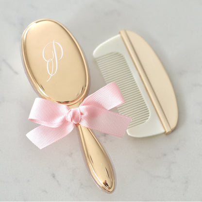 Silver, Gold, or Rose Gold plated baby brush and comb set, which comes in a box. The brush can personalised on the back with 1-2 initials.