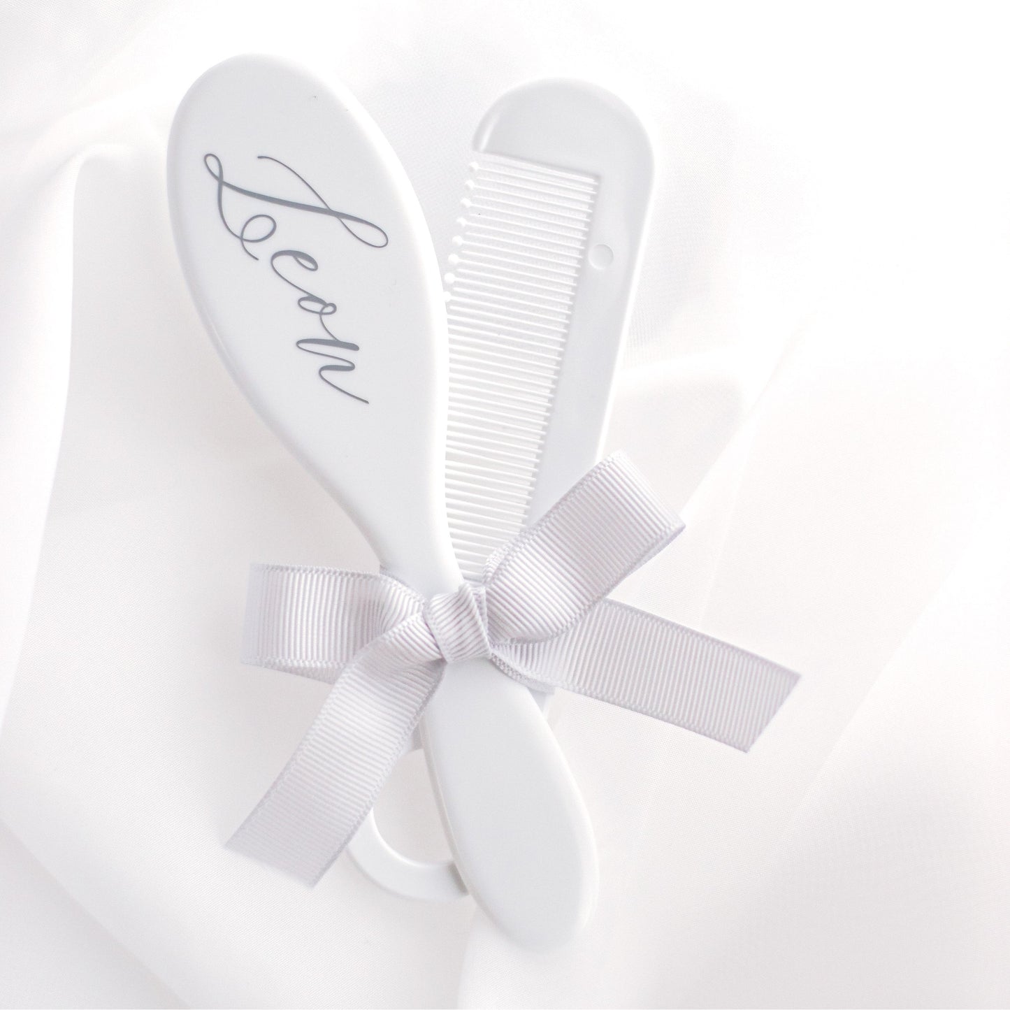 White Personalised Brush & Comb Set - The brush can personalised on the back with the child's name or initials. The brush is intended for babies and has soft bristles.